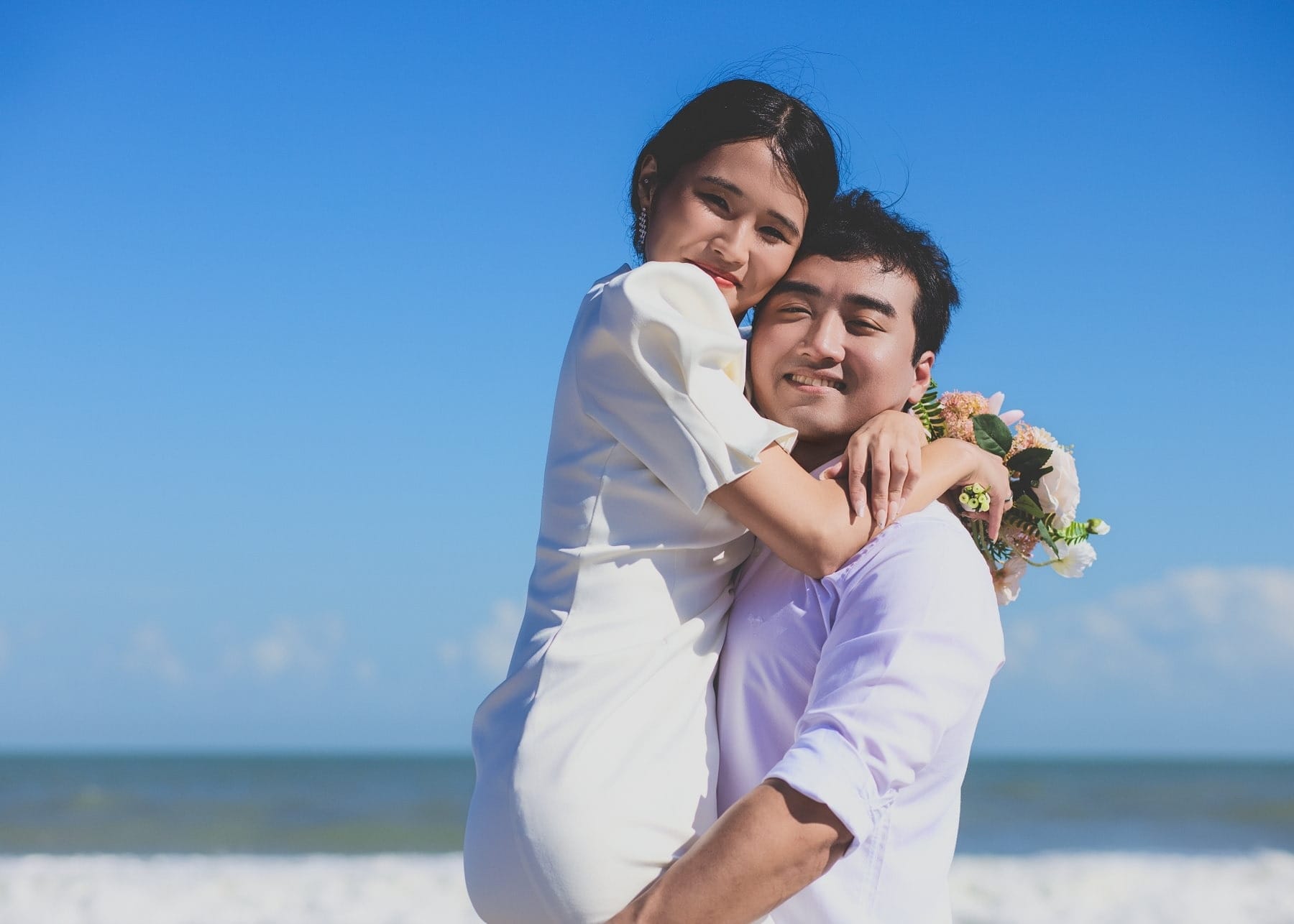 Couple embracing on a bright beach