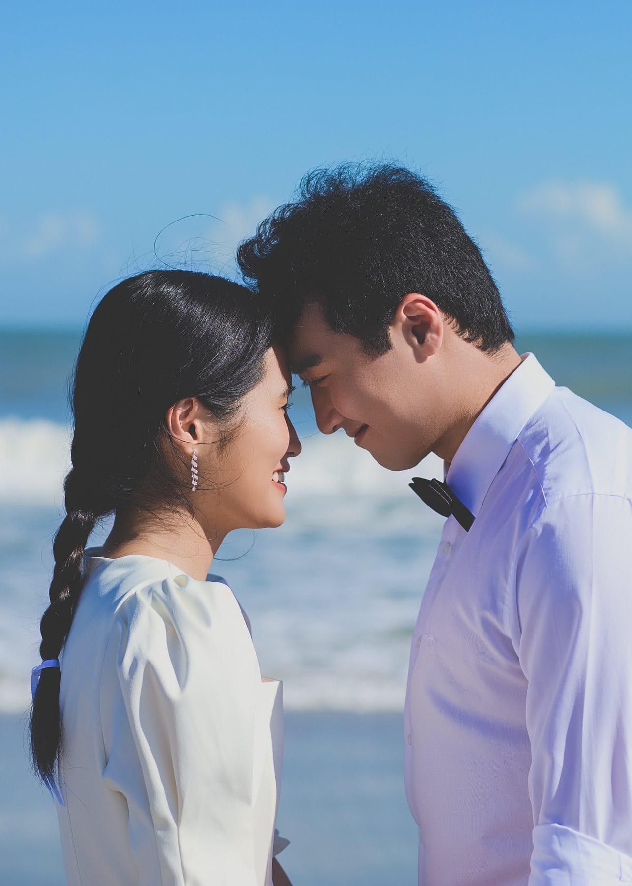 Close portrait of a couple touching foreheads