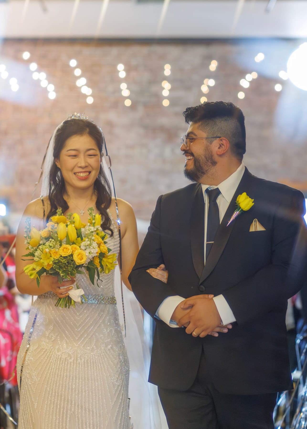 Bride and groom walking down the aisle together