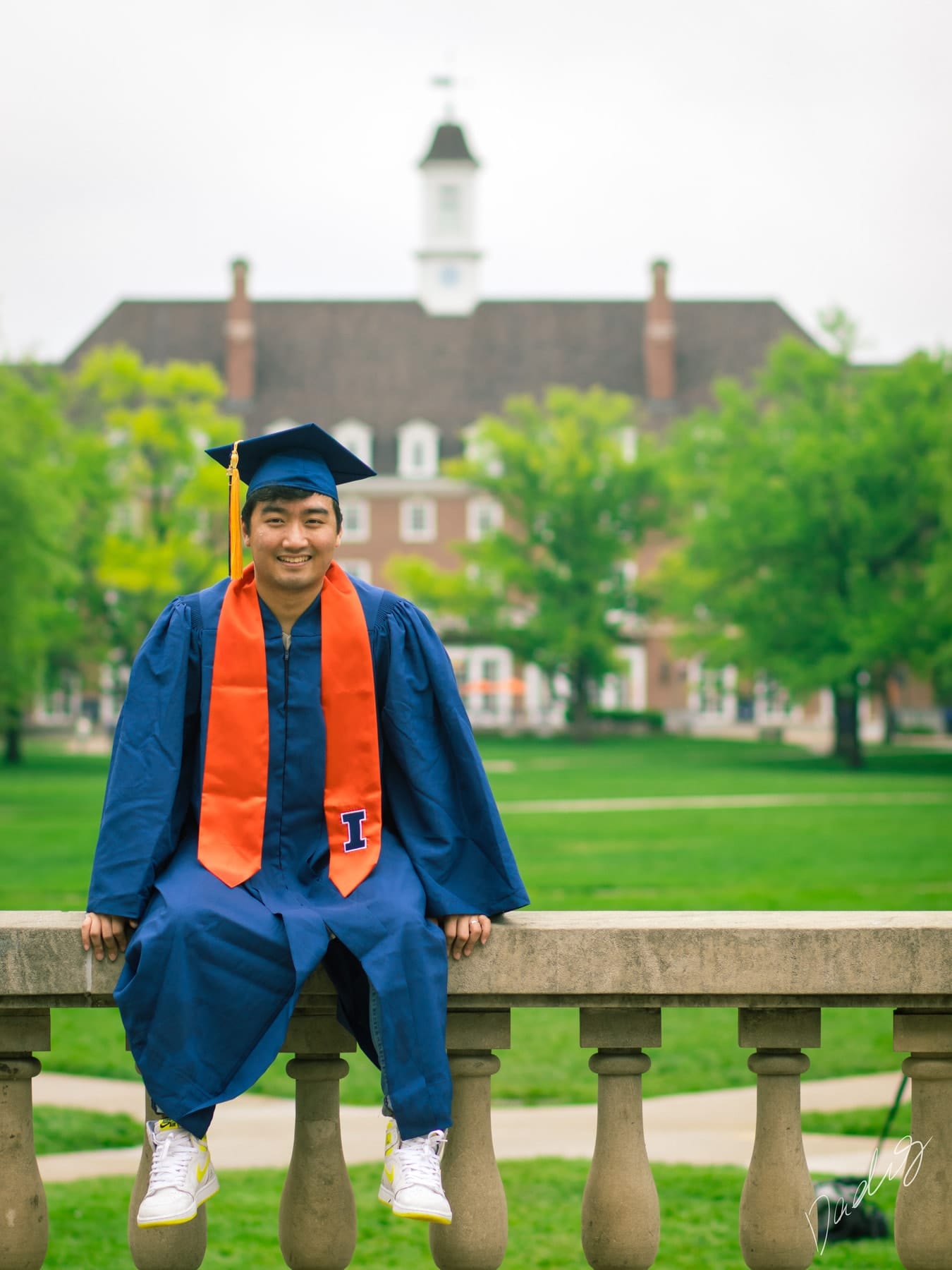 Graduate in his cap on the balustrade