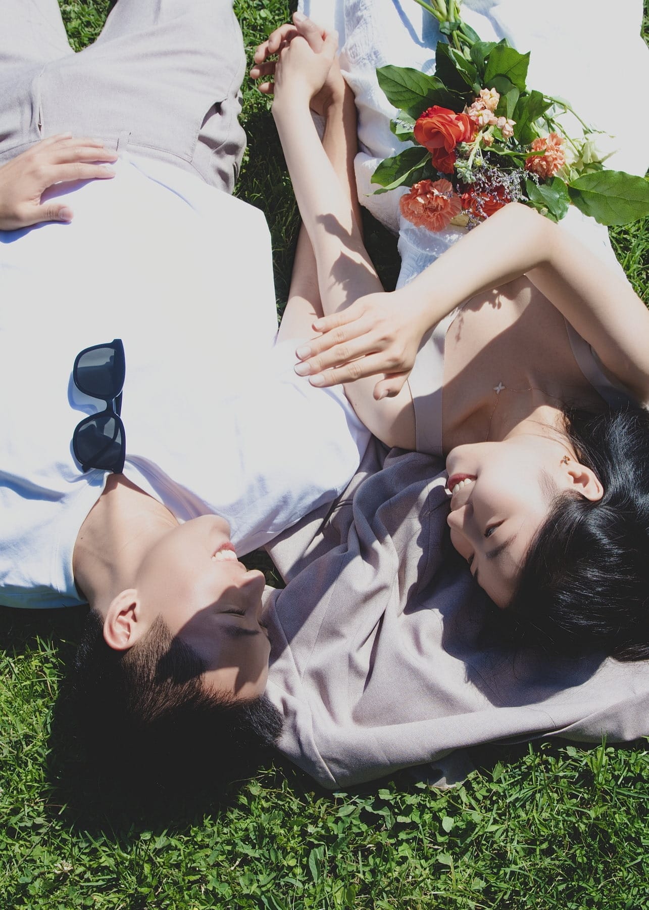 Couple resting together on the grass in a close portrait